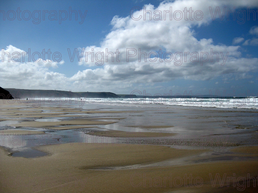 IMG 1969 
 Chapel Porth beach in Cornwall. the water had collected in dips in the sand, and made for an impressing photograph. Photographed by myself, Charlotte Wright Photography 
 Keywords: beach, sea, sand, waves, water, clouds, cornwall, reflections, chapel porth, United Kingdom, photography