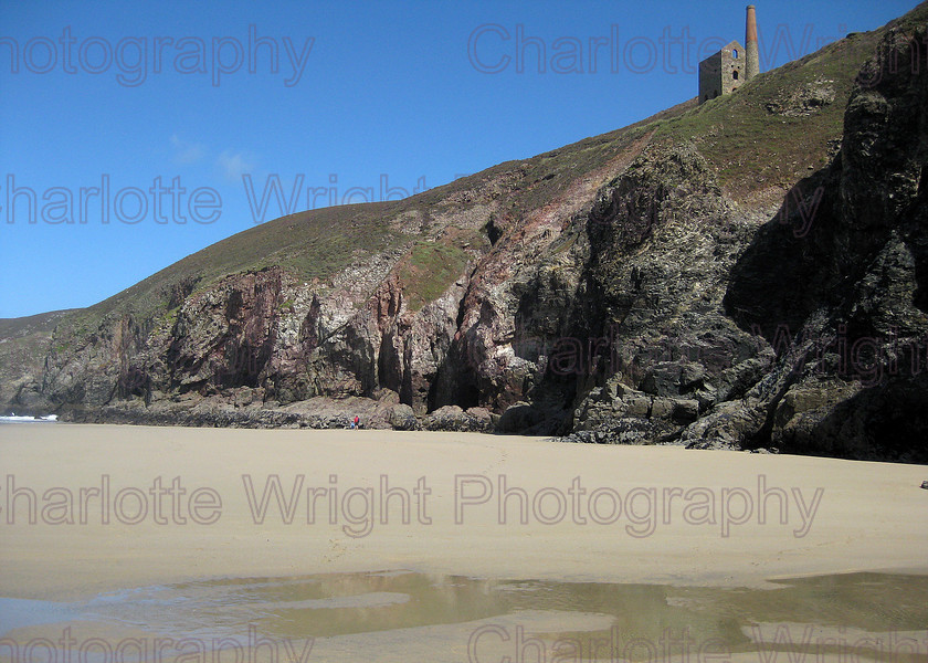 IMG 1983 
 Chapel Porth beach in Cornwall, with the Wheal Coates engine house above. This is a truelly impressive beach. Photographed by myself, Charlotte Wright Photography 
 Keywords: chapel porth, cornwall, beach, wheal coates, engine house, sand, United Kingdom, photography