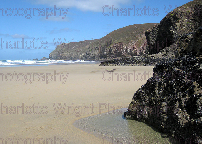 IMG 1951 
 Chapel Porth beach, in Cornwall. Looking past the cliffs, over the sand the the sea. Photographed by myself, Charlotte Wright Photography 
 Keywords: beach, sea, waves, sand, cliffs, chapel porth, cornwall, United Kingdom, photography