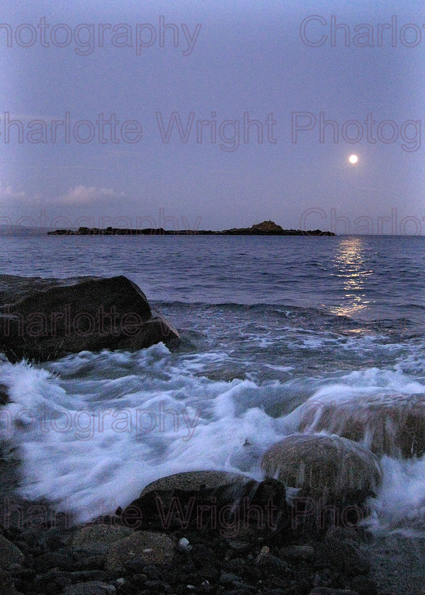IMG 1425 
 The sea at dusk on Mousehole's pebble beach in Cornwall. The moon was so bright this was handheld! Photographed by myself, Charlotte Wright Photography 
 Keywords: waves, pebbles, moon, stone, beach, St Clemants Isle, Mousehole, Cornwall, sea, United Kingdom, photography