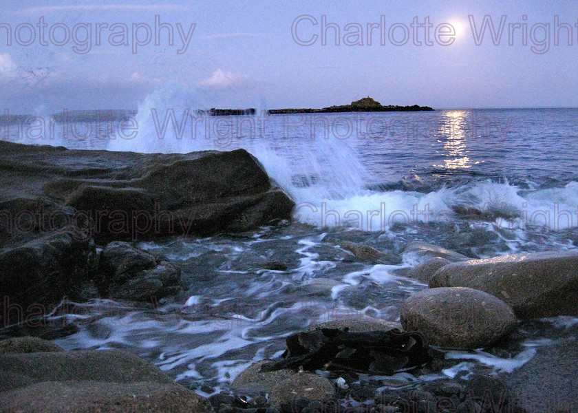 IMG 1436 
 The sea at dusk on Mousehole's pebble beach in Cornwall. The moon was so bright this was handheld! Photographed by myself, Charlotte Wright Photography 
 Keywords: waves, stones, sea, pebble, beach, St Clemants isle, Mousehole, Cornwall, moon, United Kingdom, photography